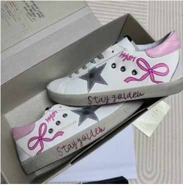 Golden bow sneakers